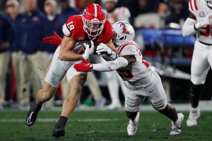 Georgia tight end Brock Bowers competes with Ole Miss safety Trey Washington during the first half of a NCAA college football game against Ole Miss in Athens, Ga., on Saturday, Nov. 11, 2023.